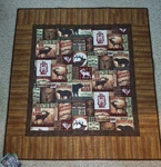 Homemade Cabin Fever Lap Quilt. Fixed Price $80.00.